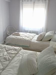 A bed or beds in a room at Piso céntrico ideal
