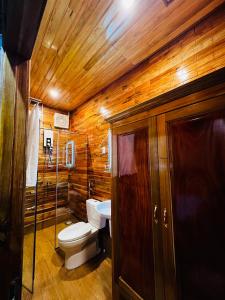 a bathroom with a toilet and a sink at Mountain House Phú Quốc in Phu Quoc