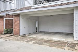 a house with a garage with a driveway at Comfortable Dallas Condo Close to Attractions in Dallas
