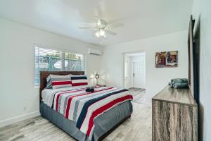 a bedroom with a bed and a ceiling fan at Singer Island Stunner 2 BR in West Palm Beach