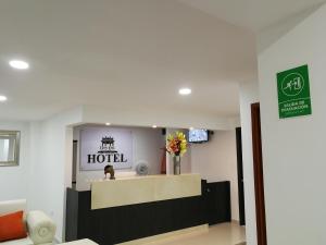 a lobby of a hotel with a reception desk at Hotel Don Jose in Ciénaga