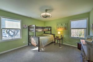a bedroom with a bunk bed and two windows at Seaside Escape Less Than 1 Mi to Cape May Public Beach in West Cape May