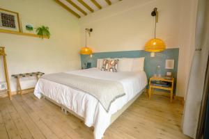 Cama o camas de una habitación en Hotel Plantación