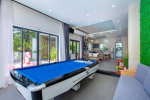 a living room with a pool table in it at Minh Phước Villa in Vung Tau