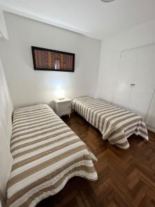 מיטה או מיטות בחדר ב-Mira Bosques