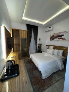 A bed or beds in a room at Bricks Residence