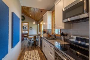 a kitchen with white cabinets and a counter top at Valley View in Banner Elk