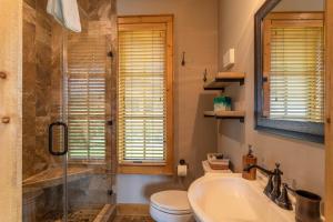 a bathroom with a sink and a toilet and a shower at Valley View in Banner Elk +13 photos