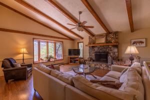 a living room with a couch and a fireplace at A Slice of Seven in Seven Devils