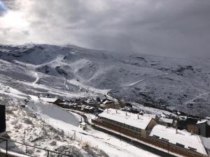 a small town with a train in the snow at Sierra Nevada Cabaña de madera in Sierra Nevada