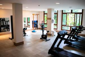 a gym with several exercise bikes in a room at Loft 335 Vista Azul in Pedra Azul