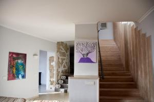 a staircase in a house with a painting on the wall at Villa Margherita in Naples