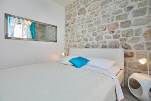 Katil atau katil-katil dalam bilik di Festa Apartments & Rooms
