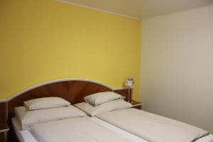 Postel nebo postele na pokoji v ubytování Hotel Altneudörflerhof