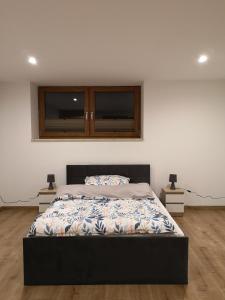 Posteľ alebo postele v izbe v ubytovaní Apartament u ANI