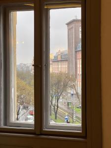 an open window with a view of a city at F14 Guest house by Small Home Budapest in Budapest