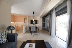 A kitchen or kitchenette at Lagonisi luxurious residence Nelly's Jacuzzi house