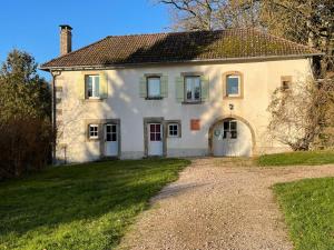a large white house with a driveway at La Manufacture Royale de Bains in Bains-les-Bains +94 photos