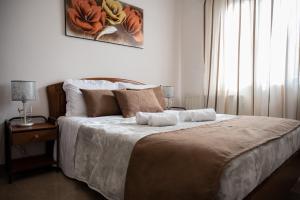 Ένα ή περισσότερα κρεβάτια σε δωμάτιο στο Lala Luxury House