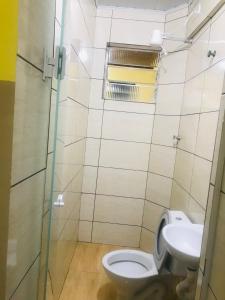 a bathroom with a toilet and a sink at Hotel Gasometro in São Paulo