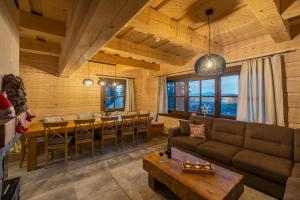 a living room with a couch and a table at Drevenica Lesanka in Demanovska Dolina +44 photos