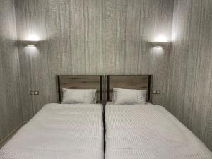 Postel nebo postele na pokoji v ubytování Bonvenon capsule Hostel