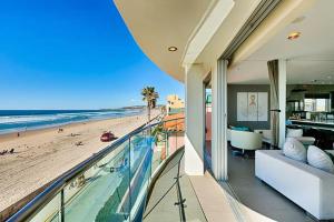 a view of the beach from the balcony of a house at Crown Jewel in Mission Beach at Ocean Front Walk in San Diego