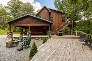 a house with a wooden deck in front of it at A River Mist Too in Sugar Grove