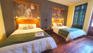 Letto o letti in una camera di Hotel Inti Quito