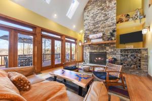 a living room with a couch and a fireplace at Wisp'd Away in Swanton