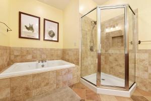 a bathroom with a tub and a shower at Wisp'd Away in Swanton +62 photos