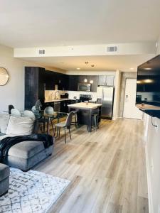 a living room with a couch and a kitchen at Mission City Bay in San Francisco