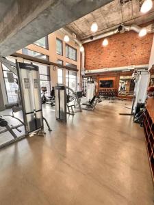 a gym with several machines in a large room at Mission City Bay in San Francisco