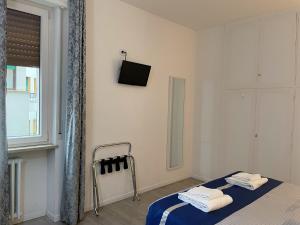 Postel nebo postele na pokoji v ubytování Residenza Borgo Trento SUNDAY