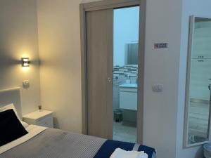 Postel nebo postele na pokoji v ubytování Residenza Borgo Trento SUNDAY