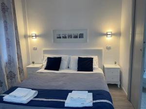 Postel nebo postele na pokoji v ubytování Residenza Borgo Trento SUNDAY