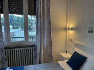 Postel nebo postele na pokoji v ubytování Residenza Borgo Trento SUNDAY