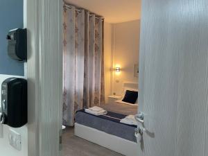Postel nebo postele na pokoji v ubytování Residenza Borgo Trento SUNDAY