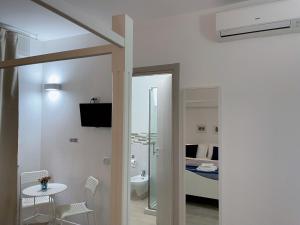 TV a/nebo společenská místnost v ubytování Residenza Borgo Trento SUNDAY