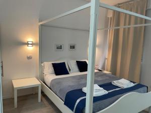 Postel nebo postele na pokoji v ubytování Residenza Borgo Trento SUNDAY