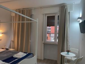 Postel nebo postele na pokoji v ubytování Residenza Borgo Trento SUNDAY