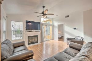 a living room with a couch and a fireplace at Cozy Home with Hot Tub about 13 Mi to Sacramento in Elk Grove