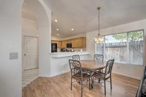 a kitchen and dining room with a table and chairs at Cozy Home with Hot Tub about 13 Mi to Sacramento in Elk Grove