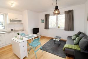 A kitchen or kitchenette at Modern Balcony Apartment with free Parking