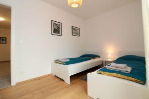 A bed or beds in a room at Modern Balcony Apartment with free Parking