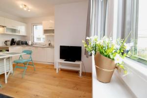 A kitchen or kitchenette at Modern Balcony Apartment with free Parking
