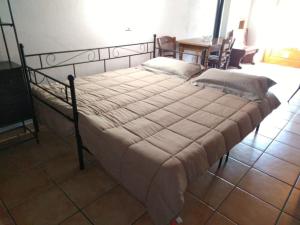 Un pat sau paturi într-o cameră la Mulino Valsorda