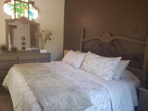 Postel nebo postele na pokoji v ubytování Tres Fuentes Hotel Boutique