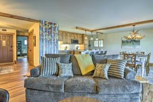 a living room with a couch and a kitchen at MtnandLake Views and 3 Mi to Skiing Dillon Condo in Dillon
