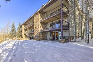 an apartment building in the snow with a driveway at MtnandLake Views and 3 Mi to Skiing Dillon Condo in Dillon